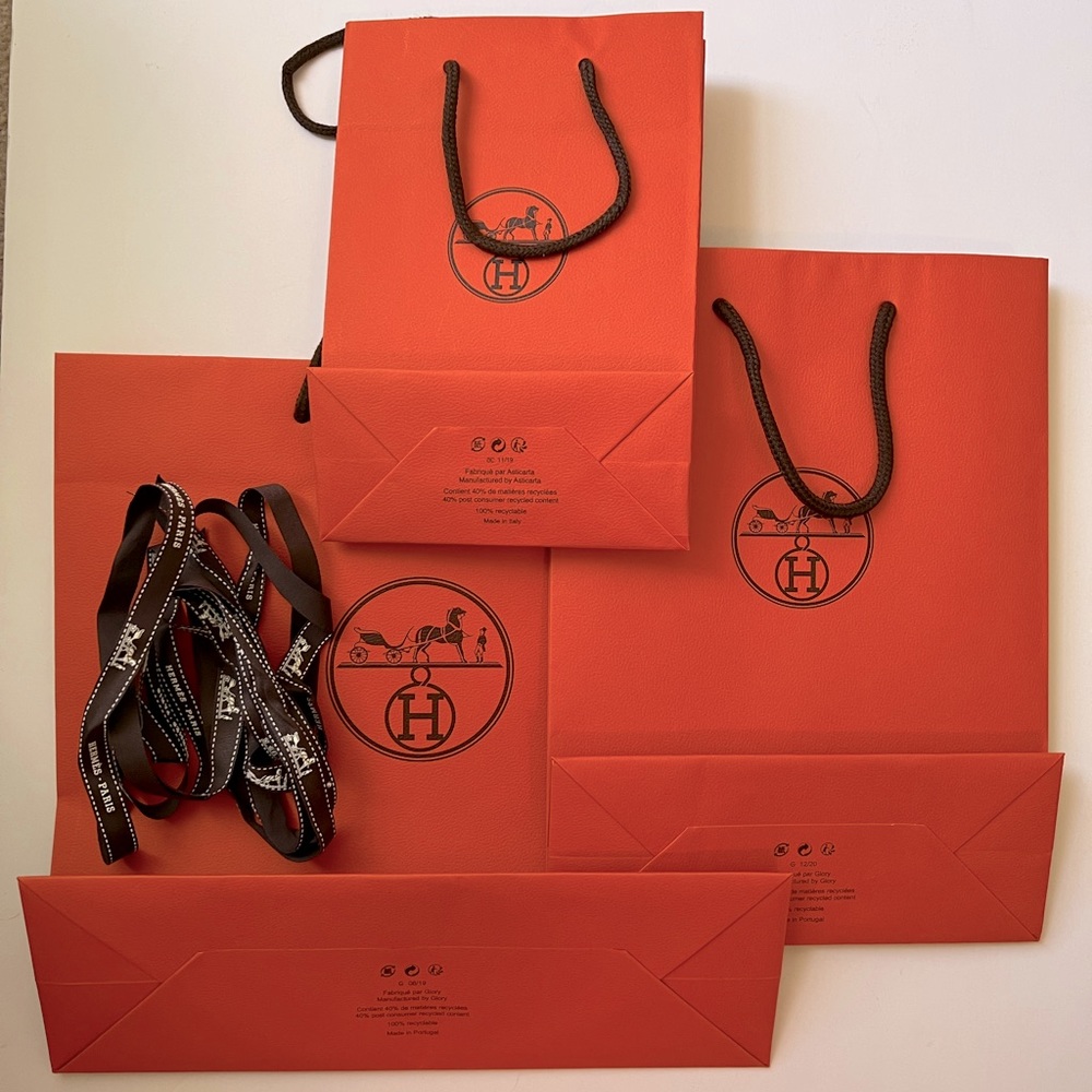 Three 100% Authentic Hermès Shopping Bags and three ribbons